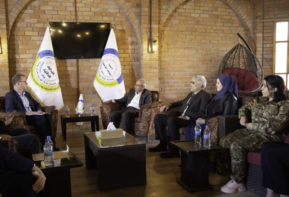 Canadian diplomats, left, in northeast Syria to secure the release of Kimberly Polman in October 2022.