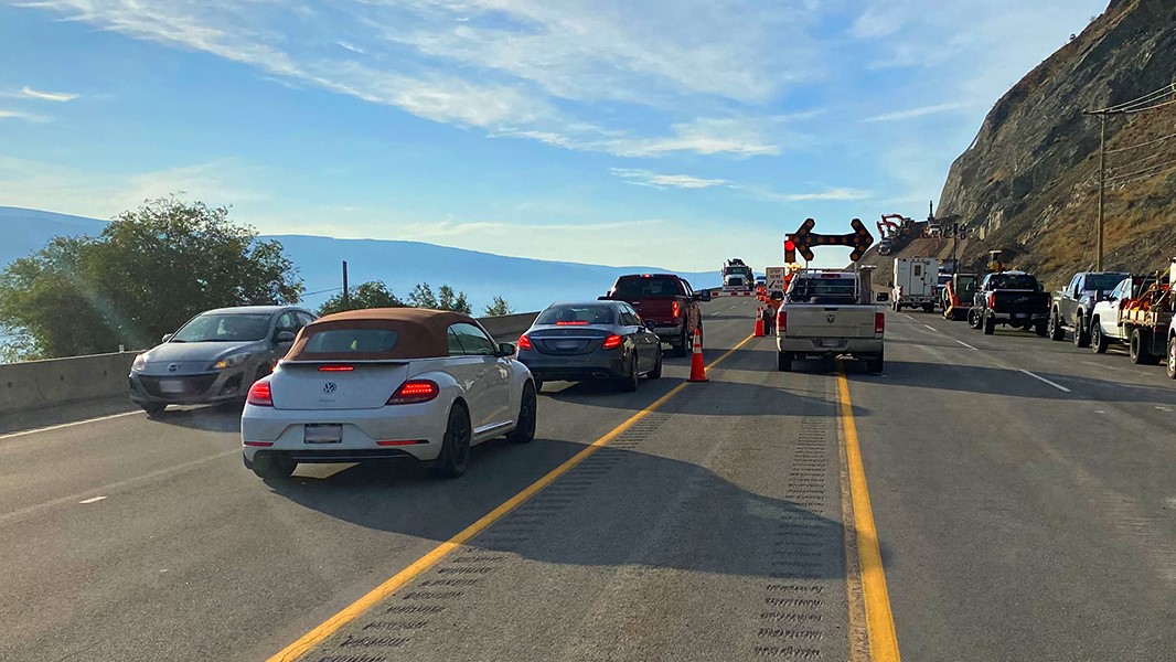 File photo. Traffic moves past the rockslide along Highway 97 near Summerland, B.C.