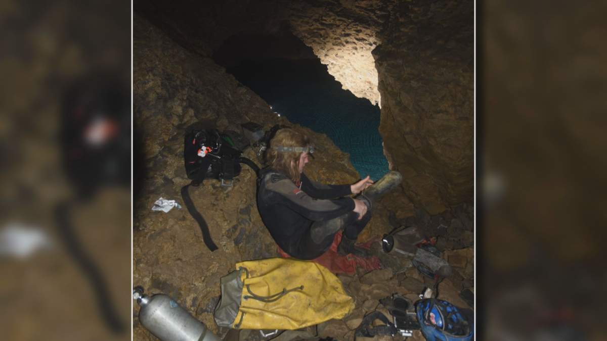 Undated photograph of Katie Graham, the subject of the film Subterranean, inside a cave.