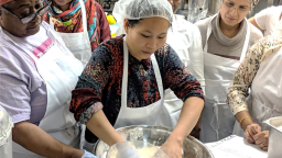 Staff preparing meals in a kitchen