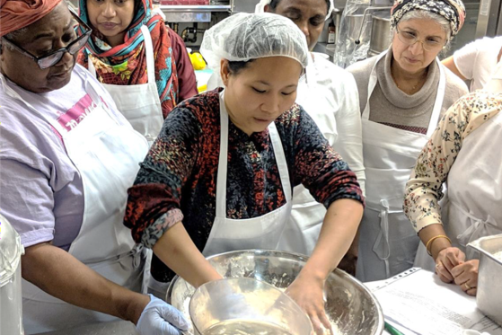 Staff preparing meals in a kitchen