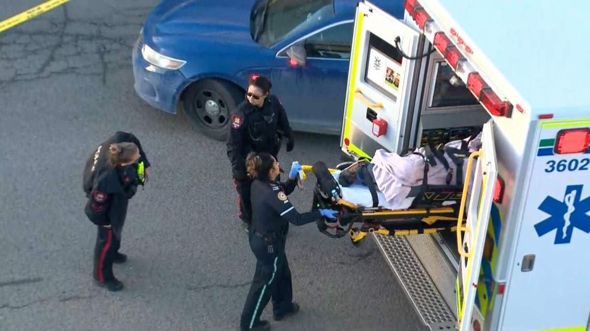 EMS load a patient into an ambulance following a call of an assault with a weapon at Calgary's Market Mall on Nov. 24, 2023.
