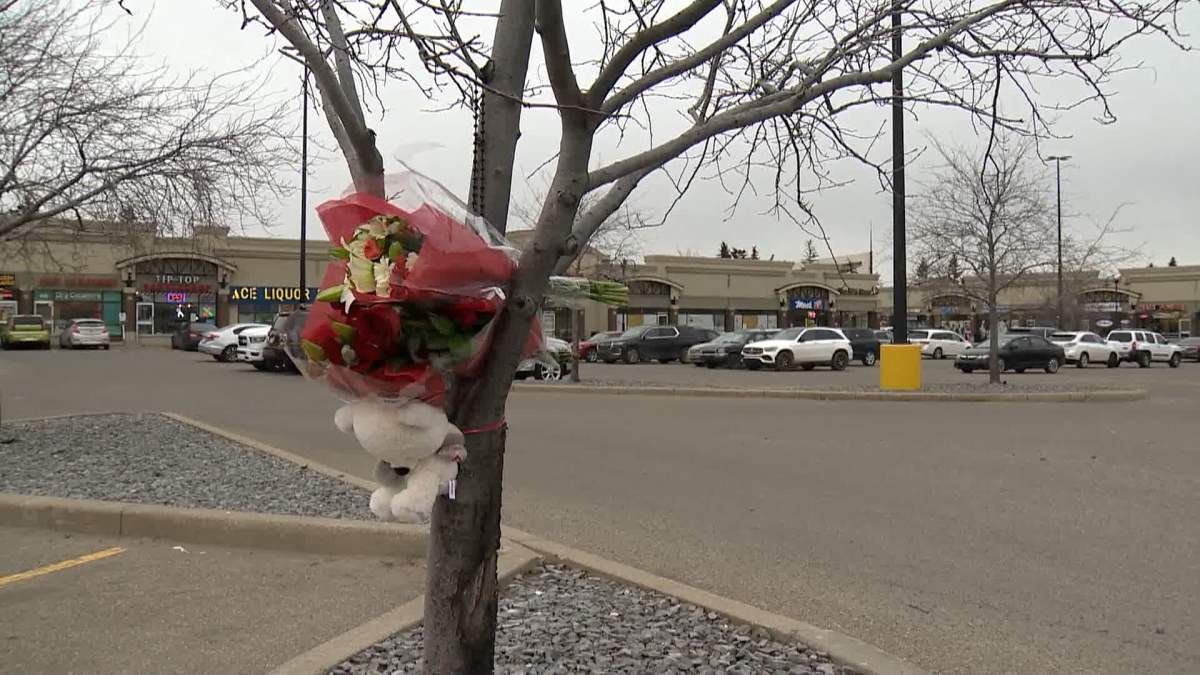 A makeshift memorial in the parking lot of the Trans Canada Centre in northeast Calgary following a Nov. 13 shooting that left one man dead and two people injured.