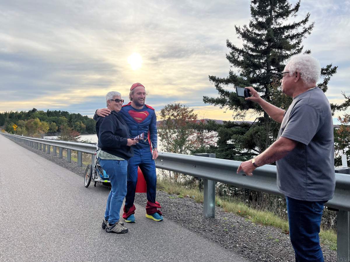 Jon Nabbs taking pictures with two folks he met in Ontario