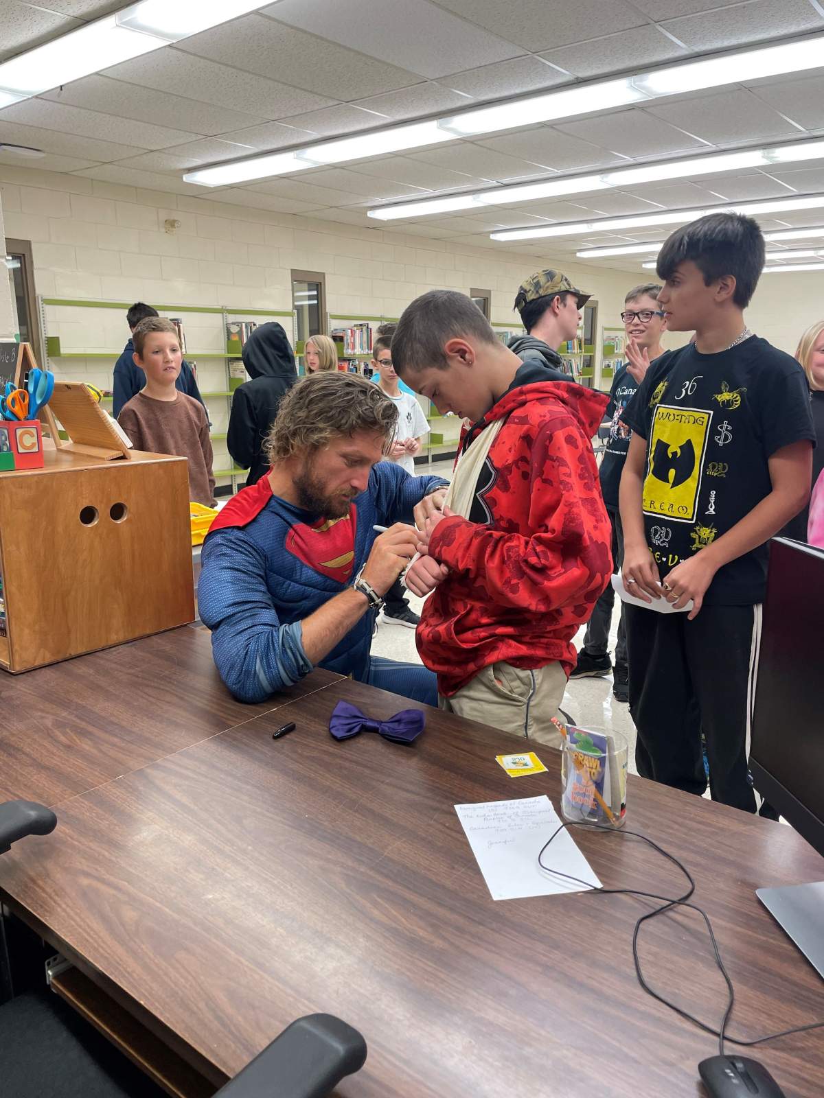 Jon Nabbs in his Superman costume with the children in the cancer ward.