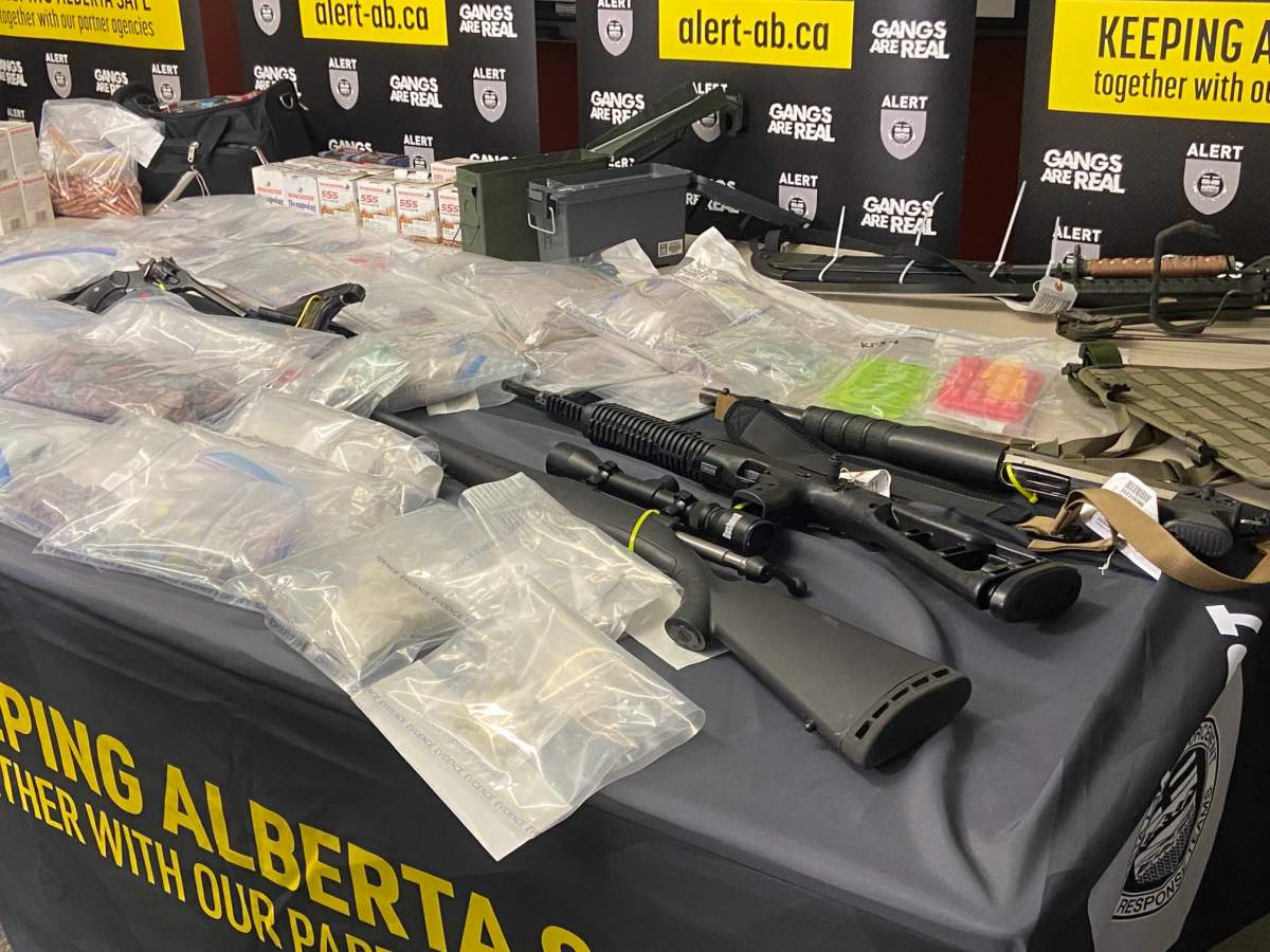 Drugs such as fentanyl, methamphetamine, cocaine and GHB, along with guns and cash seized from a Red Deer home in October show at an Alberta Law Enforcement Response Teams (ALERT) news conference on Tuesday, November 14, 2023.