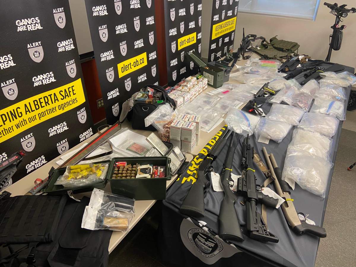 Drugs such as fentanyl, methamphetamine, cocaine and GHB, along with guns and cash seized from a Red Deer home in October show at an Alberta Law Enforcement Response Teams (ALERT) news conference on Tuesday, November 14, 2023.