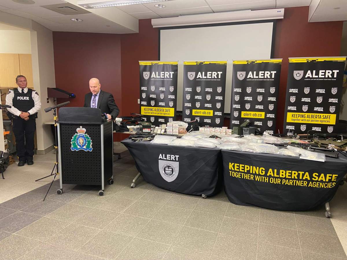 Drugs such as fentanyl, methamphetamine, cocaine and GHB, along with guns and cash seized from a Red Deer home in October show at an Alberta Law Enforcement Response Teams (ALERT) news conference on Tuesday, November 14, 2023.