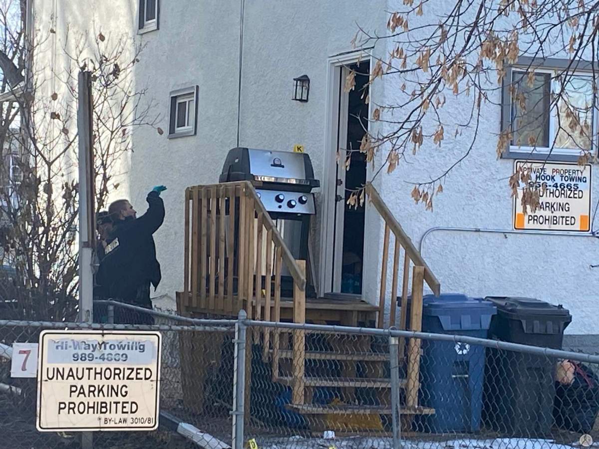 Winnipeg police at the scene of a homicide on Bannatyne Avenue Monday.