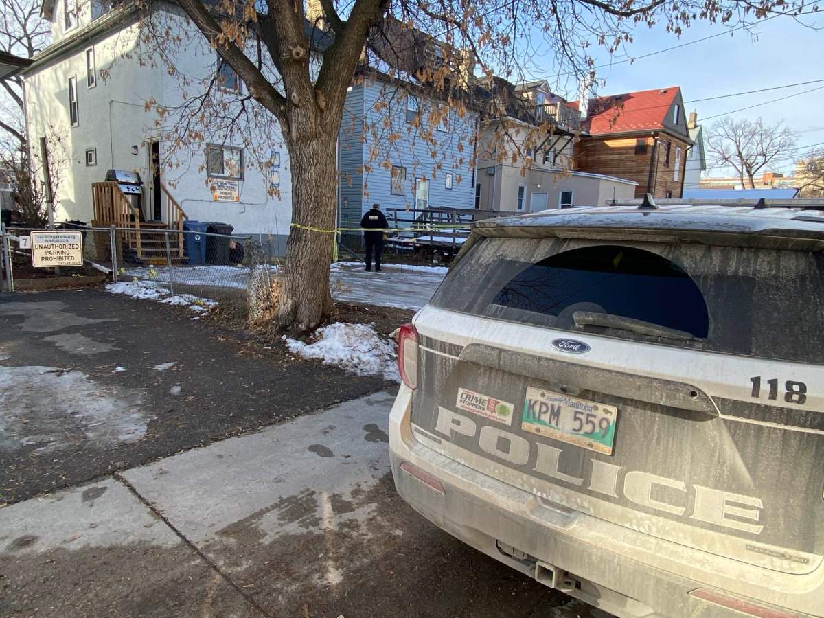 Winnipeg police at the scene of a homicide on Bannatyne Avenue Monday.