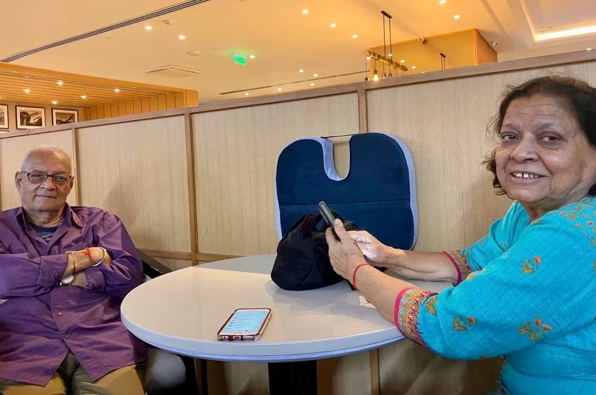 Harish Pant with family member Saroj Pande at Indira Gandhi International Airport in Delhi before a flight to Montreal on Sept. 10.
