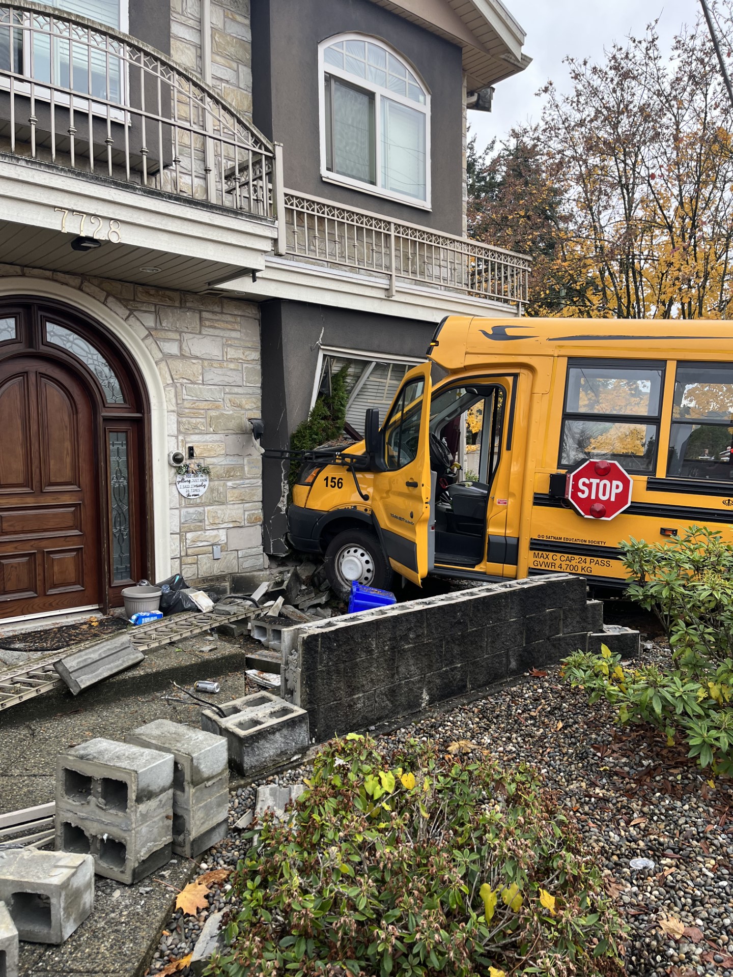 11 patients taken to hospital after school bus crashes into Burnaby, B.C. home