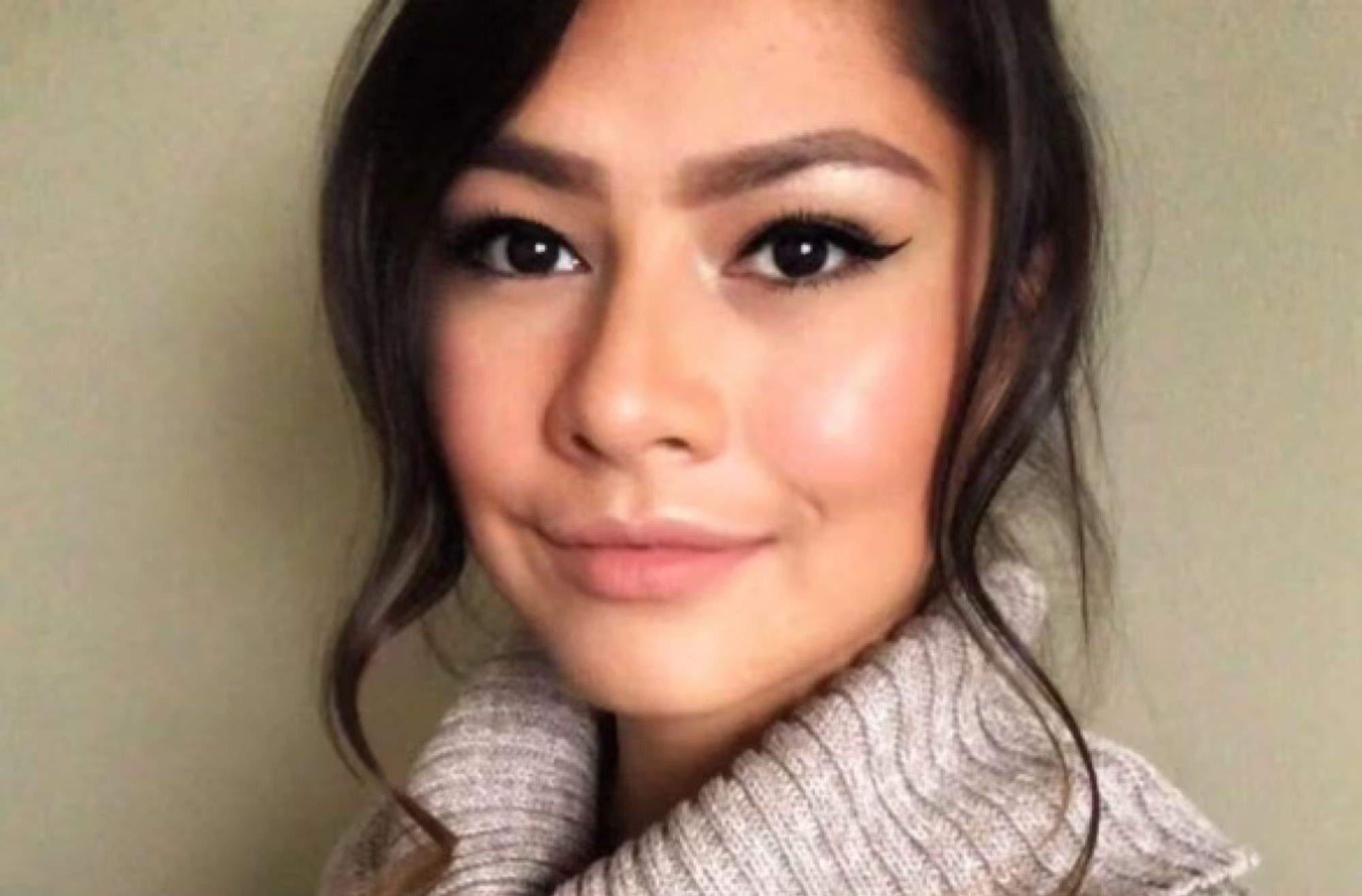 a woman smiles for a photo