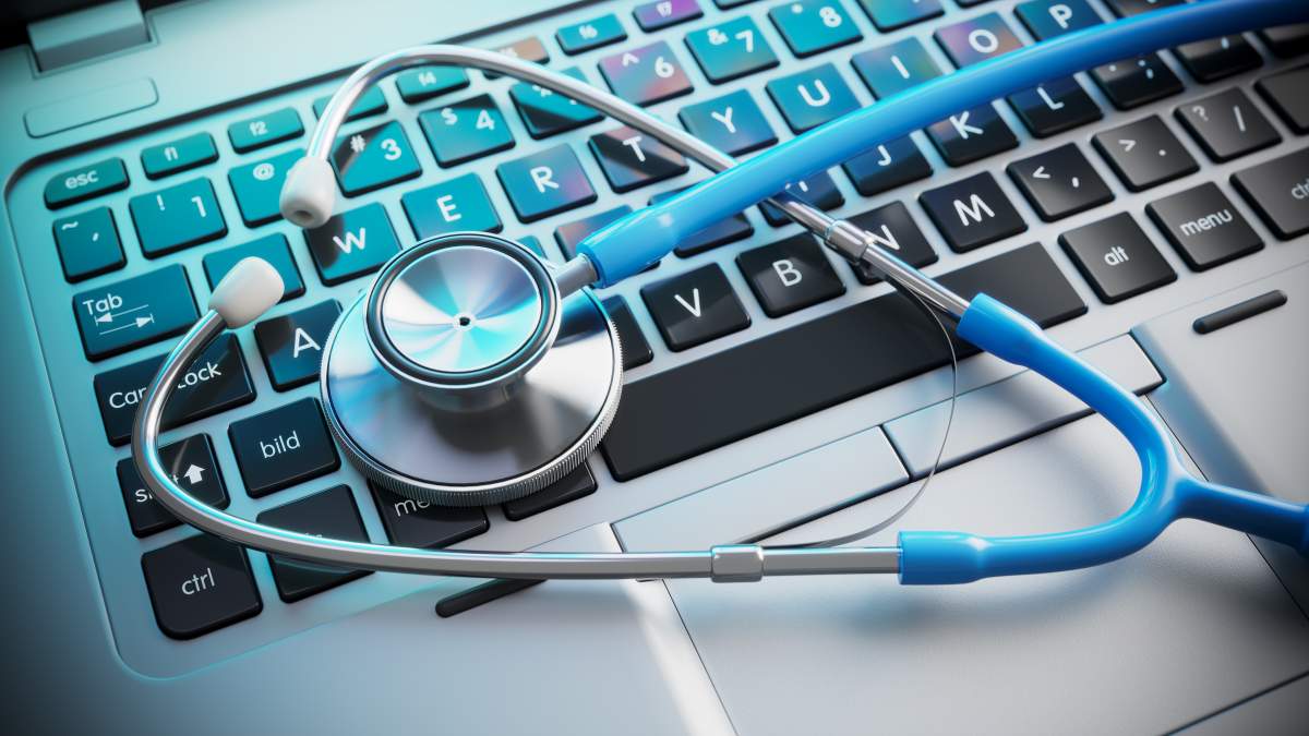Stethoscope on laptop keyboard.