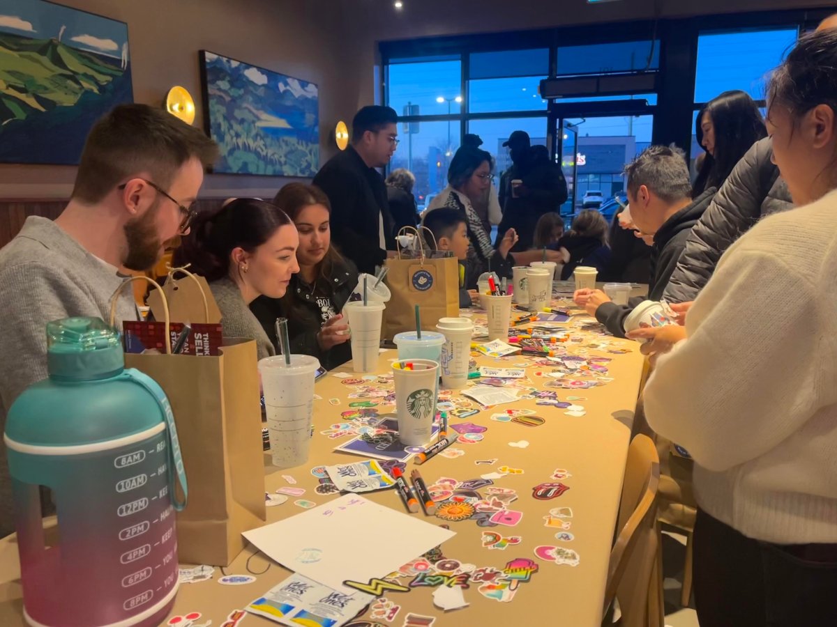 Community members decorating cups for donation at Stouffville Starbucks charity event on Nov. 17 2023