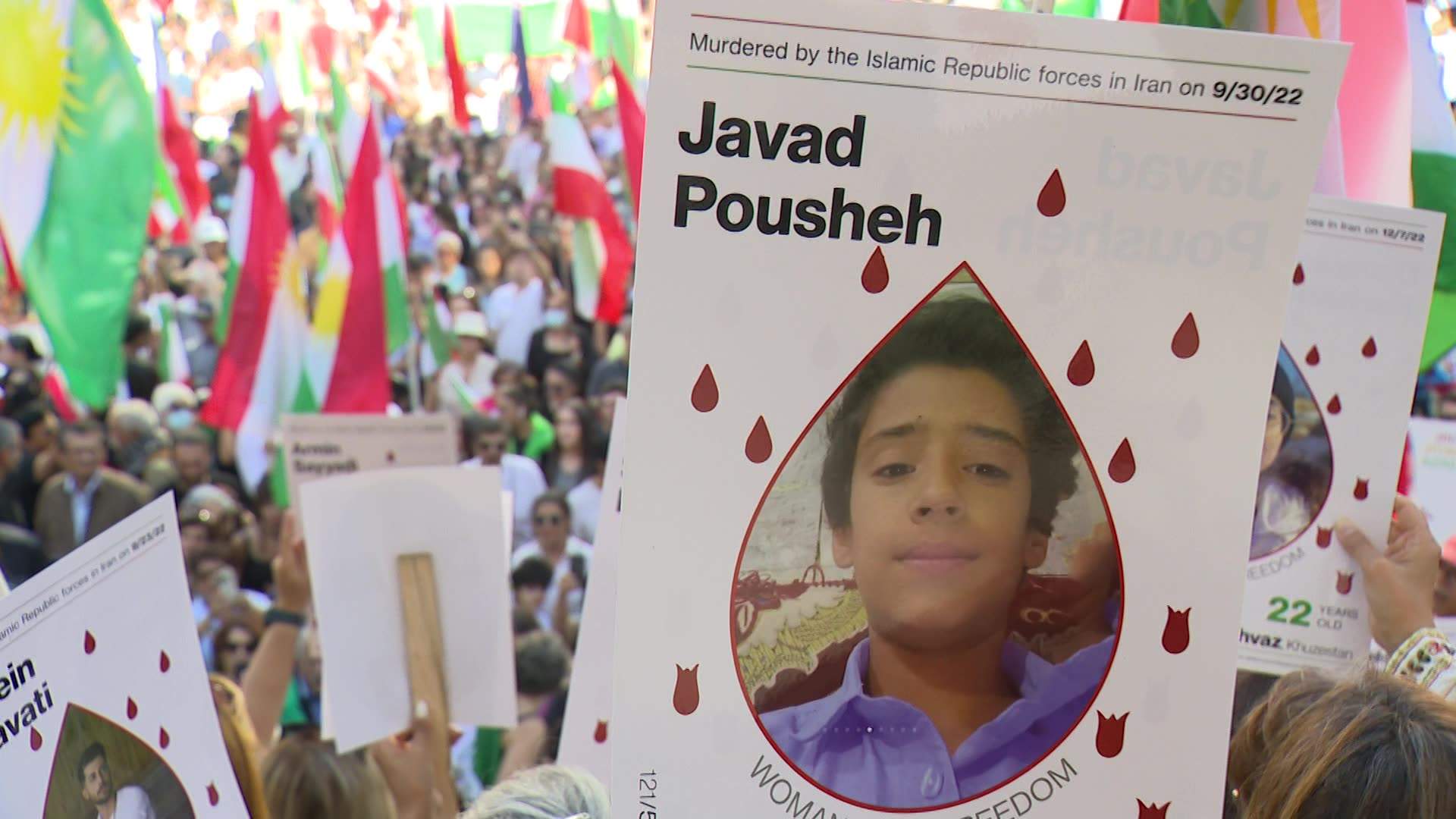 Protesters in Vancouver hold up signs of loved ones killed by the Islamic Republic of Iran, Sept. 16.