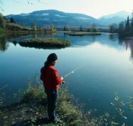 A photo of someone fishing at a lake