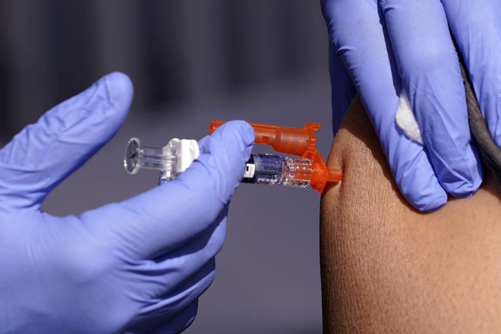 A patient is given a flu vaccine Friday, Oct. 28, 2022, in Lynwood, Calif. 