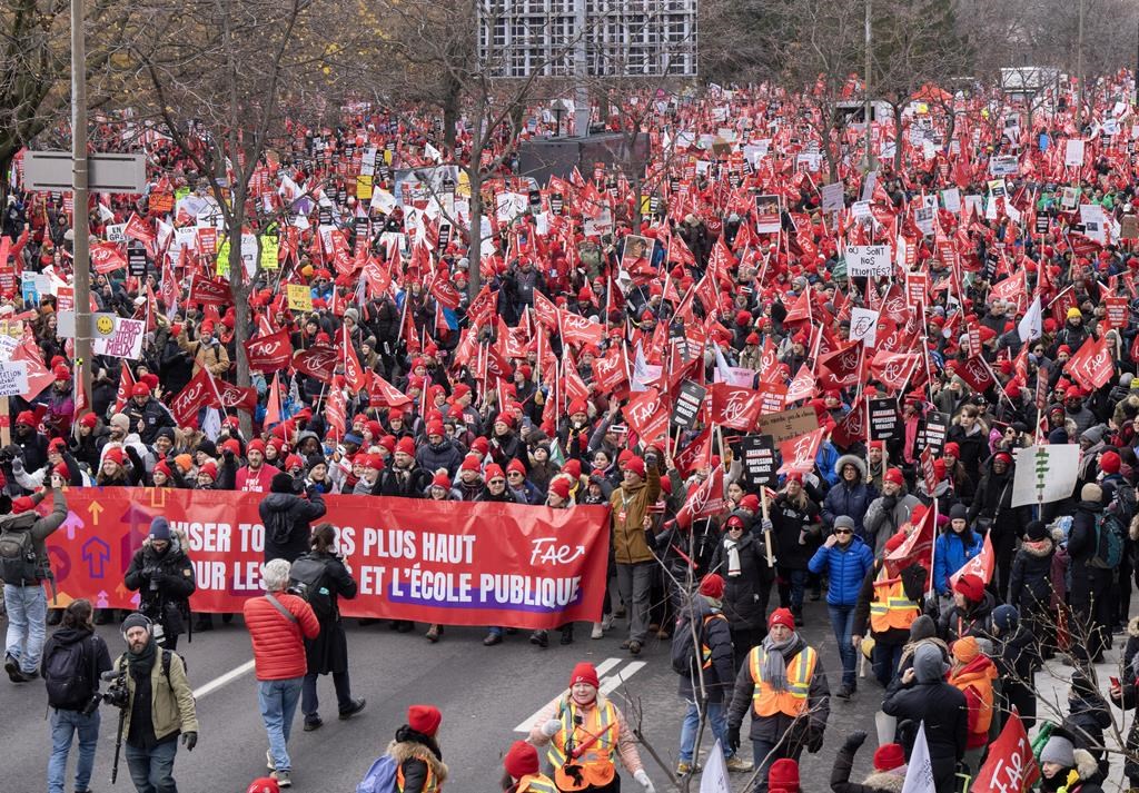 Members of the FAE teachers union march to begin their unlimited strike, Thursday, Nov. 23, 2023 in Montreal.