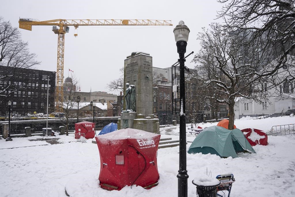 Red ice fishing enclosures are pictured at a tent encampment in downtown Halifax, Monday, Dec. 4, 2023.