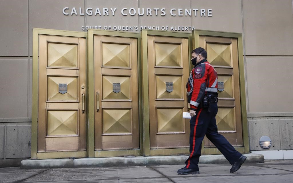 A 17-year-old Calgarian who was arrested as part of a national security investigation is to be prohibited from accessing social media and required to participate in an intervention plan that addresses ideological extremism. A police officer enters the Calgary Courts Centre in Calgary on Friday, Oct. 30, 2020.