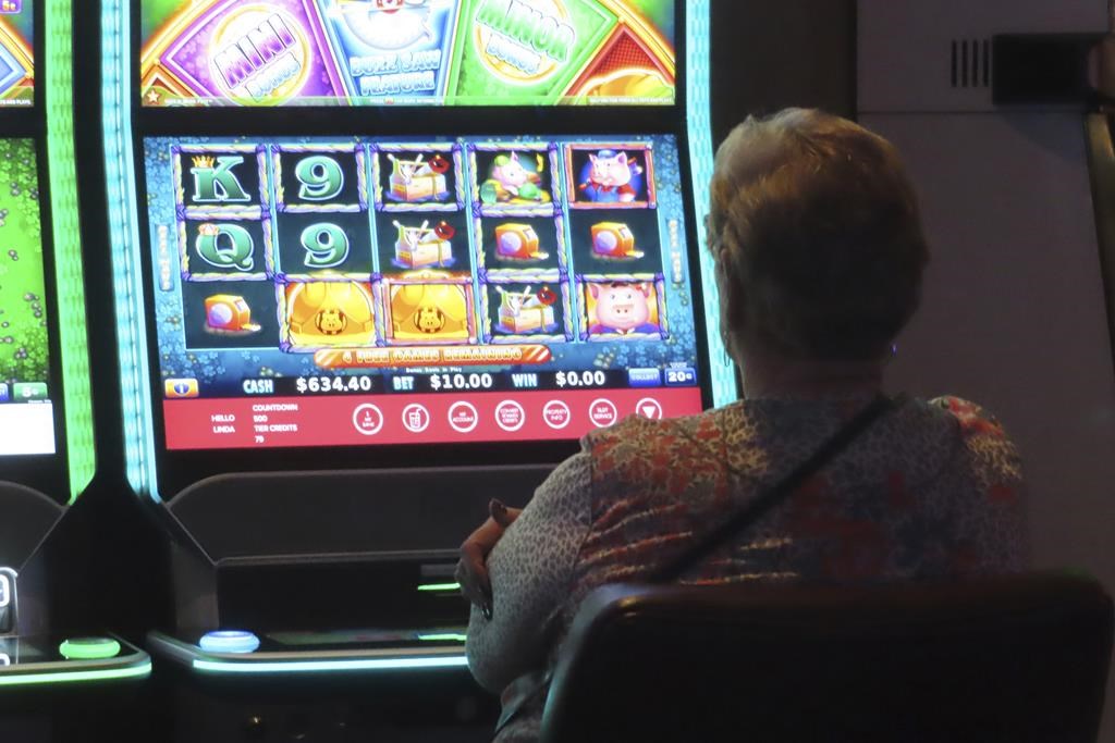 File photo of a gambler at a slot machine on Sept. 29, 2023.  