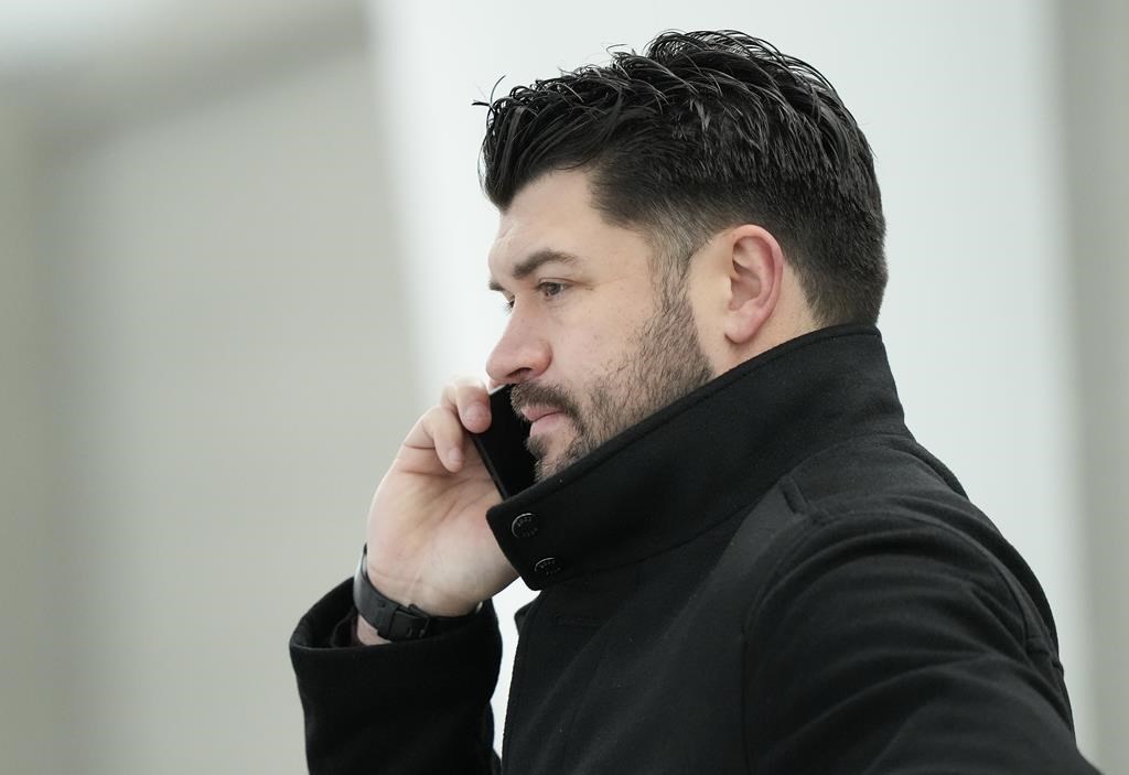 Canada's Brent Seabrook talks on the phone during Canadian World Juniors selection camp in Oakville, Ont., on Monday, Dec. 11, 2023.