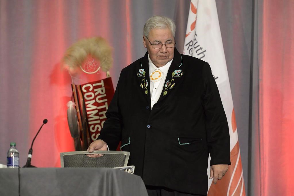 Justice Murray Sinclair takes his seat at the release of the Final Report of the Truth and Reconciliation Commission of Canada on the history of Canada’s residential school system, in Ottawa on Tuesday, Dec. 15, 2015.