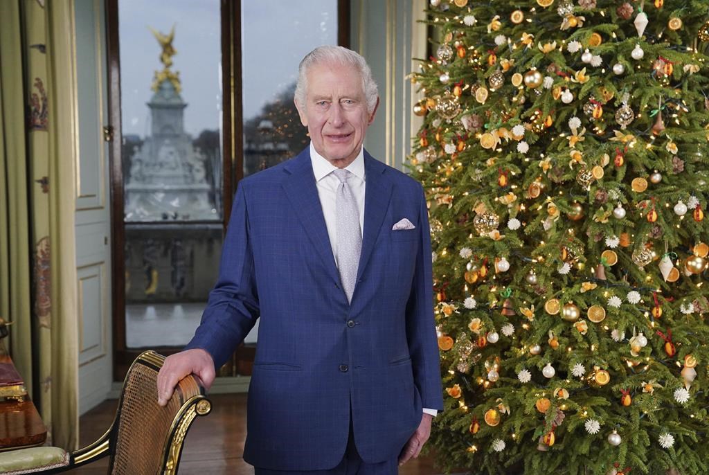 Britain's King Charles III poses for a photo, during the recording of his Christmas message at Buckingham Palace