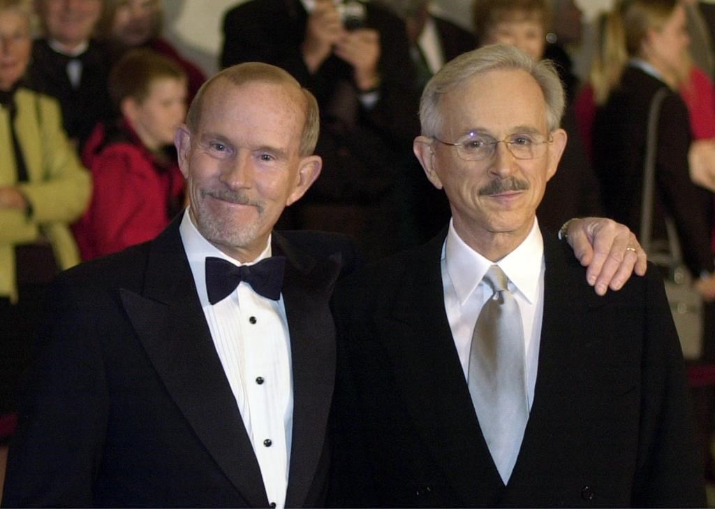 This Oct. 29, 2002 file photo shows The Smothers Brothers, Tom Smothers, left, and Dick Smothers at the Kennedy Center in Washington for the Mark Twain Prize for Humor Award ceremony honouring Bob Newhart.