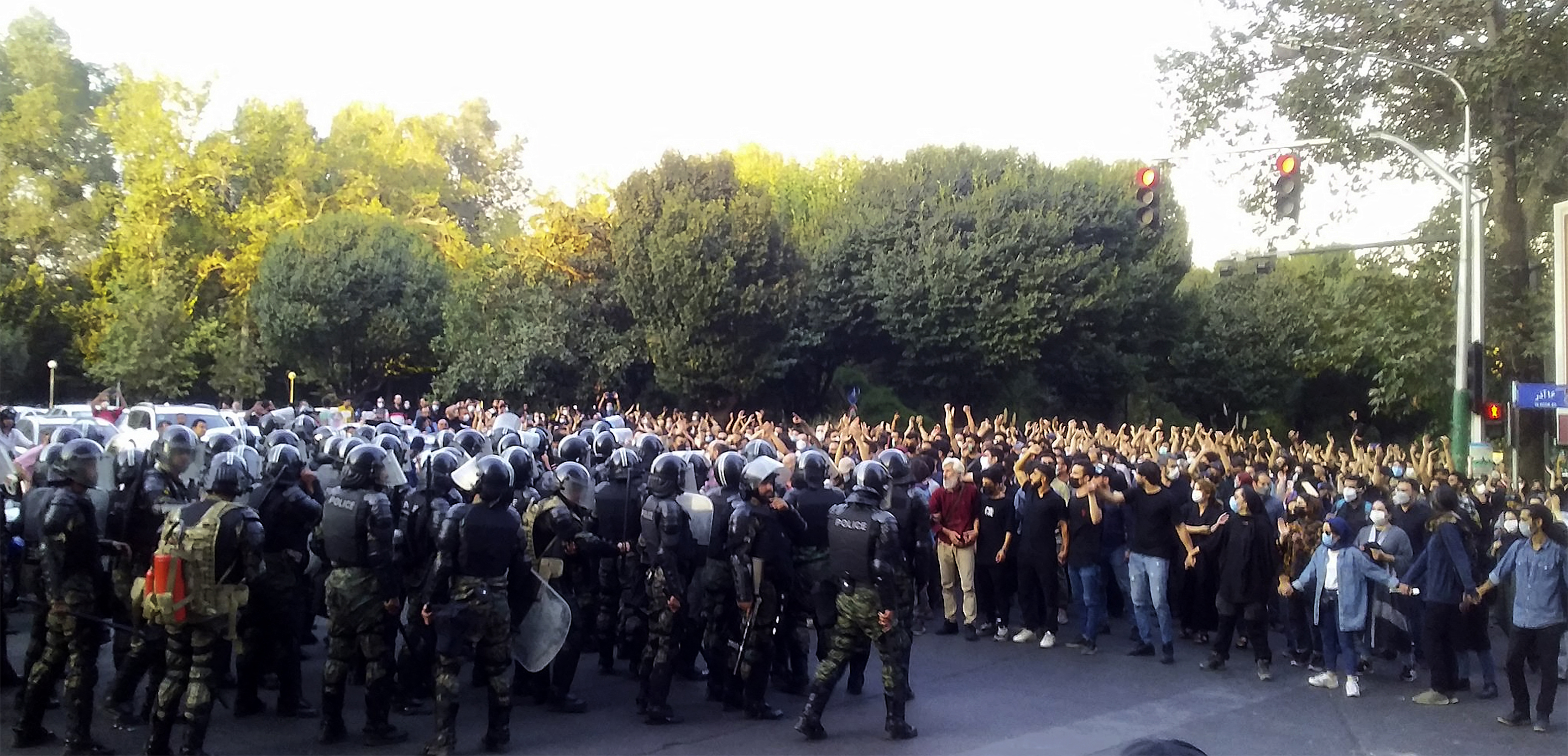 Iranian demonstrators face police at a protest for Mahsa Amini, in Tehran on Sept. 19, 2022. Photo by SalamPix/ABACAPRESS.COM