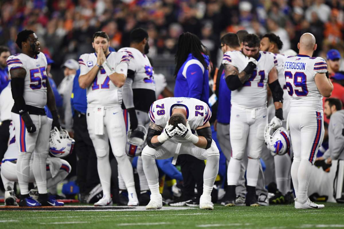 Buffalo Bills offensive tackle Spencer Brown (79) pauses as Damar Hamlin is examined by medical staff during the first half of an NFL football game against the Cincinnati Bengals, Monday, Jan. 2, 2023, in Cincinnati. Hamlin’s cardiac arrest on the field during Monday Night Football may serve as a wake-up call for many Canadians says a spokesman for the Heart and Stroke Foundation. THE CANADIAN PRESS/AP-Emilee Chinn
