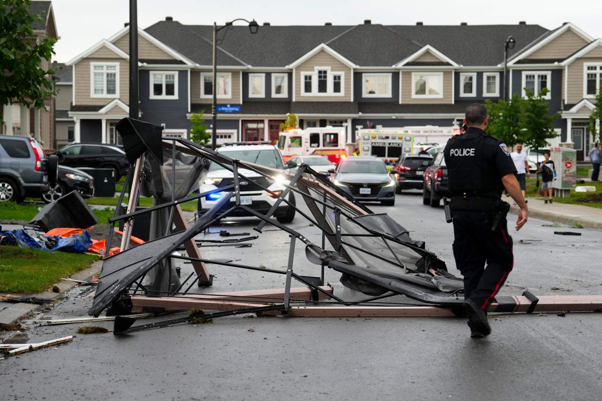 Debris fills the street following a tornado in the Ottawa suburb of Barrhaven on Thursday, July 13, 2023. Following the wreckage of a south-end Ottawa tornado, researchers and contractors are on-site looking into the aftermath that has left several homes uninhabitable. THE CANADIAN PRESS/Sean Kilpatrick