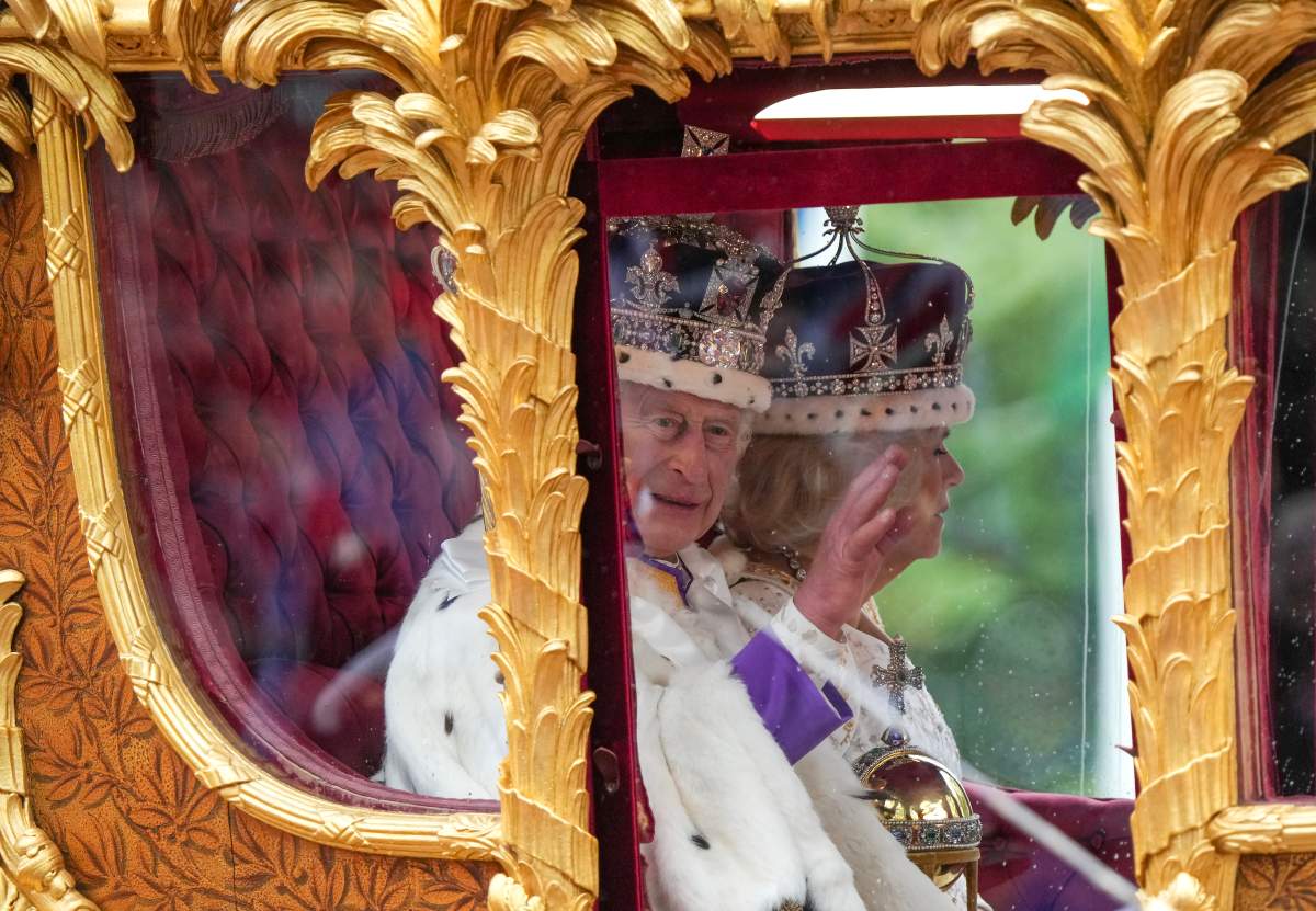 King Charles lll waves from the carriage beside Queen Camilla during the Royal Procession following the King’s Coronation, in London on Saturday, May 6, 2023. THE CANADIAN PRESS/Nathan Denette