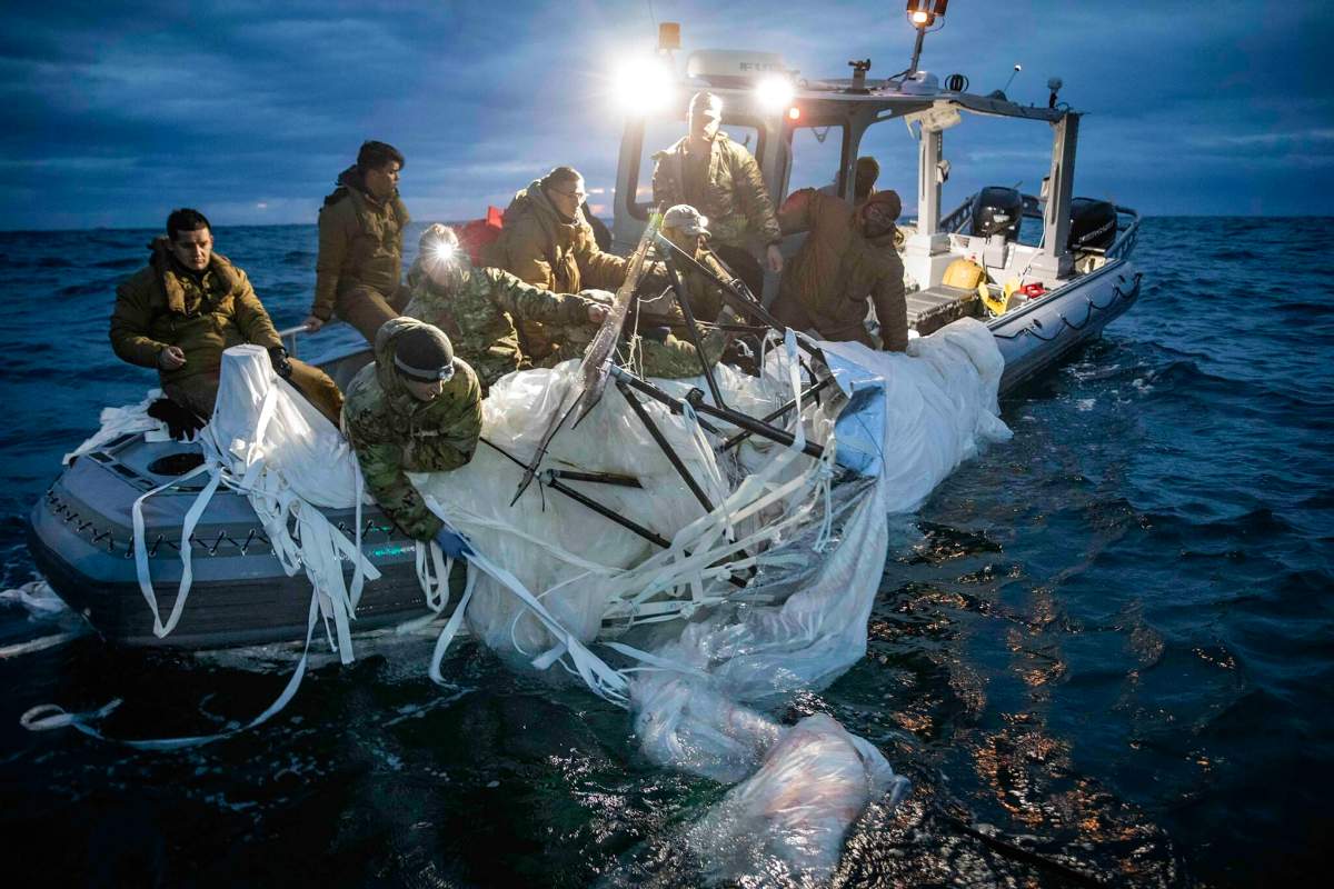 FILE – In this photo provided by the U.S. Navy, sailors assigned to Explosive Ordnance Disposal Group 2 recover a high-altitude surveillance balloon off the coast of Myrtle Beach, S.C., Feb. 5, 2023. A missile fired on Feb. 5 by a U.S. F-22 off the Carolina coast ended the days-long flight of what the Biden administration says was a surveillance operation that took the Chinese balloon near U.S. military sites. It was an unprecedented incursion across U.S. territory for recent decades, and raised concerns among Americans about a possible escalation in spying and other challenges from rival China. (U.S. Navy via AP)