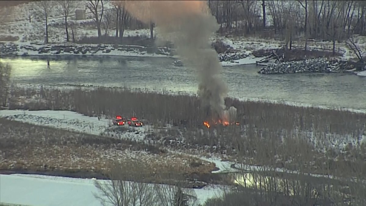 Fire crews at the scene of a Dec. 20 fire at a homeless camp along the Bow River, south of the Calf Robe Bridge.