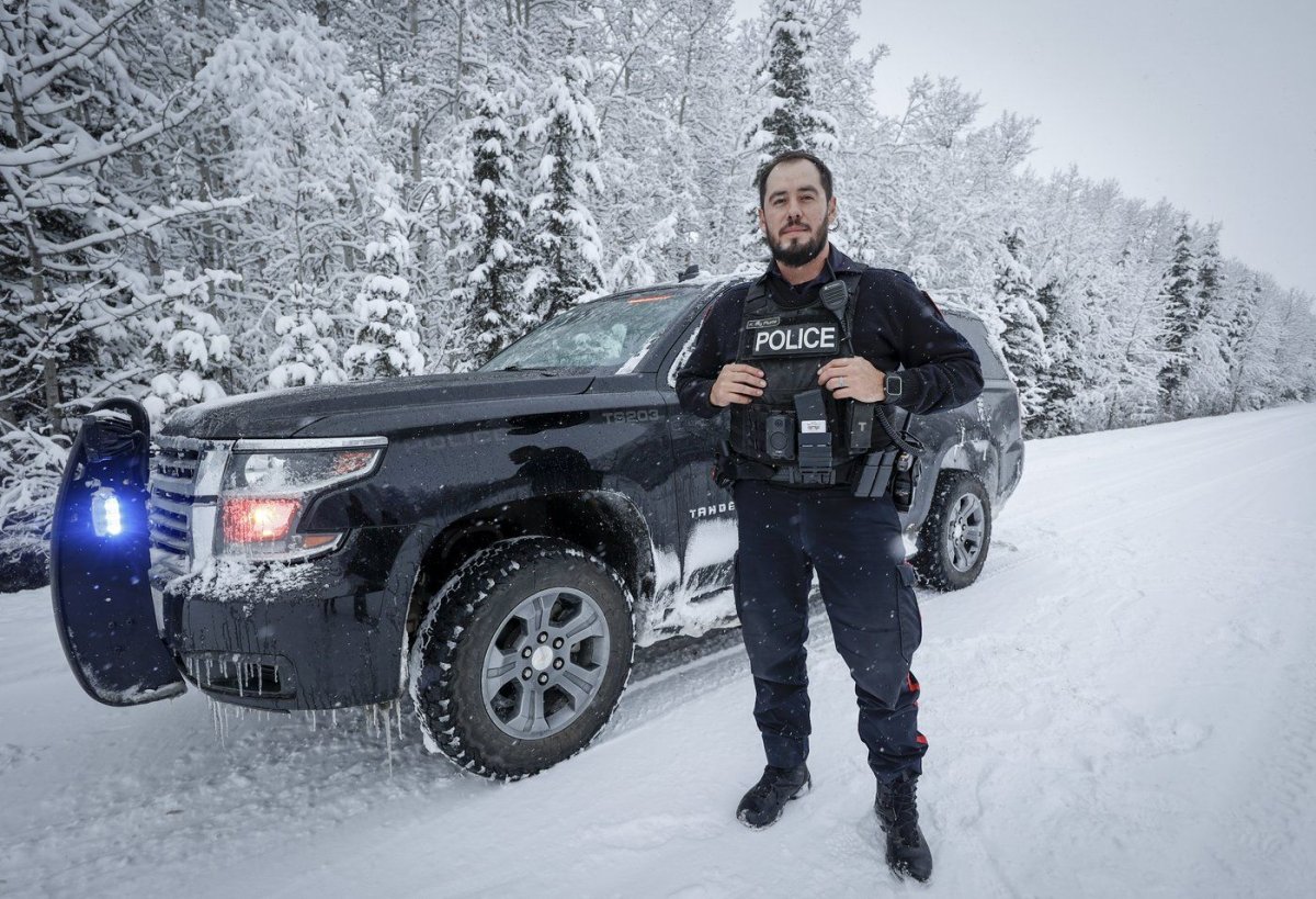 Tsuut’ina Nation Police Service Const. Kenny Big Plume on patrol on the Tsuut'ina Nation, near Calgary, Friday, Dec. 8, 2023.