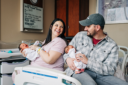 Kelsey Hatcher holds Roxi while her husband, Caleb, holds Rebel.