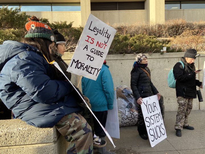 At least a dozen protesters could be seen outside the Edmonton Law Courts on Monday chanting "stop the sweeps" and "fight poverty, not the poor" ahead of a court hearing about plans to remove homeless encampments in Edmonton.