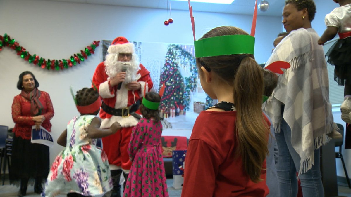 Santa brought joy to clients at The Immigrant Education Society Friday