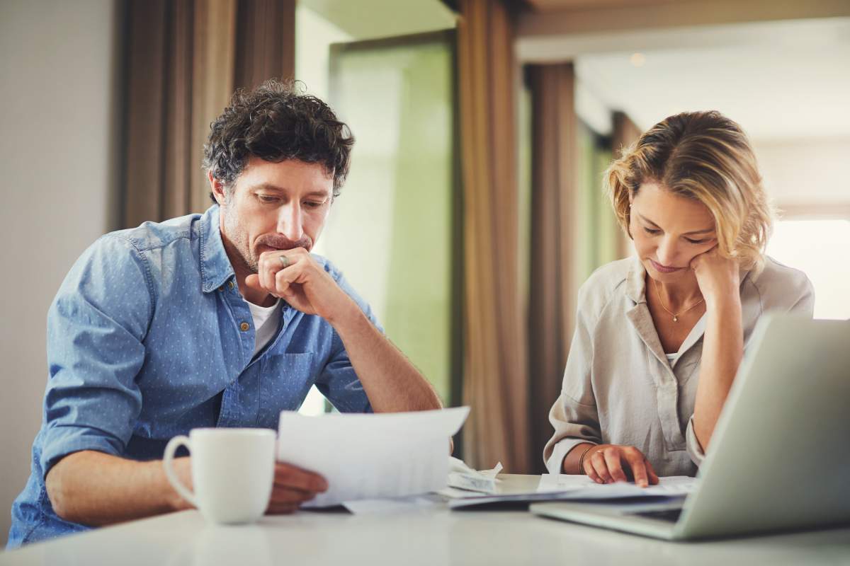 A mature couple going over their work policies and benefits