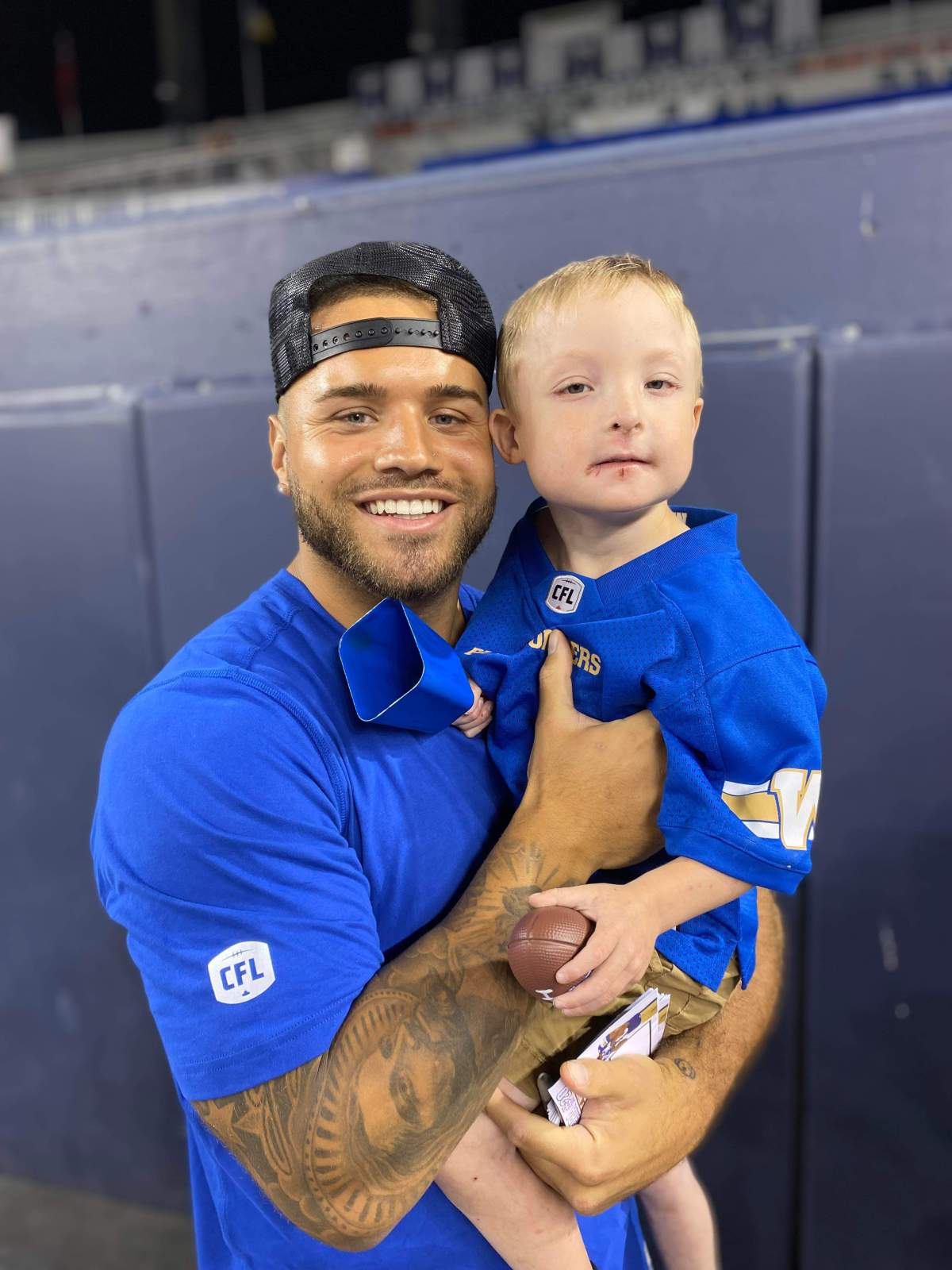 Jaxon with his favourite Blue Bomber Brady Olivera