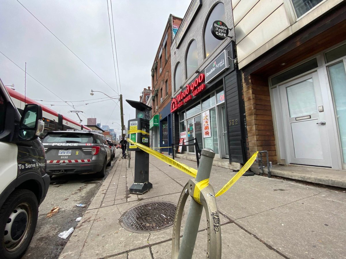 Polce tape is seen at the scene of a shooting around Queen Street East and Parliament Street on Dec. 30, 2023.