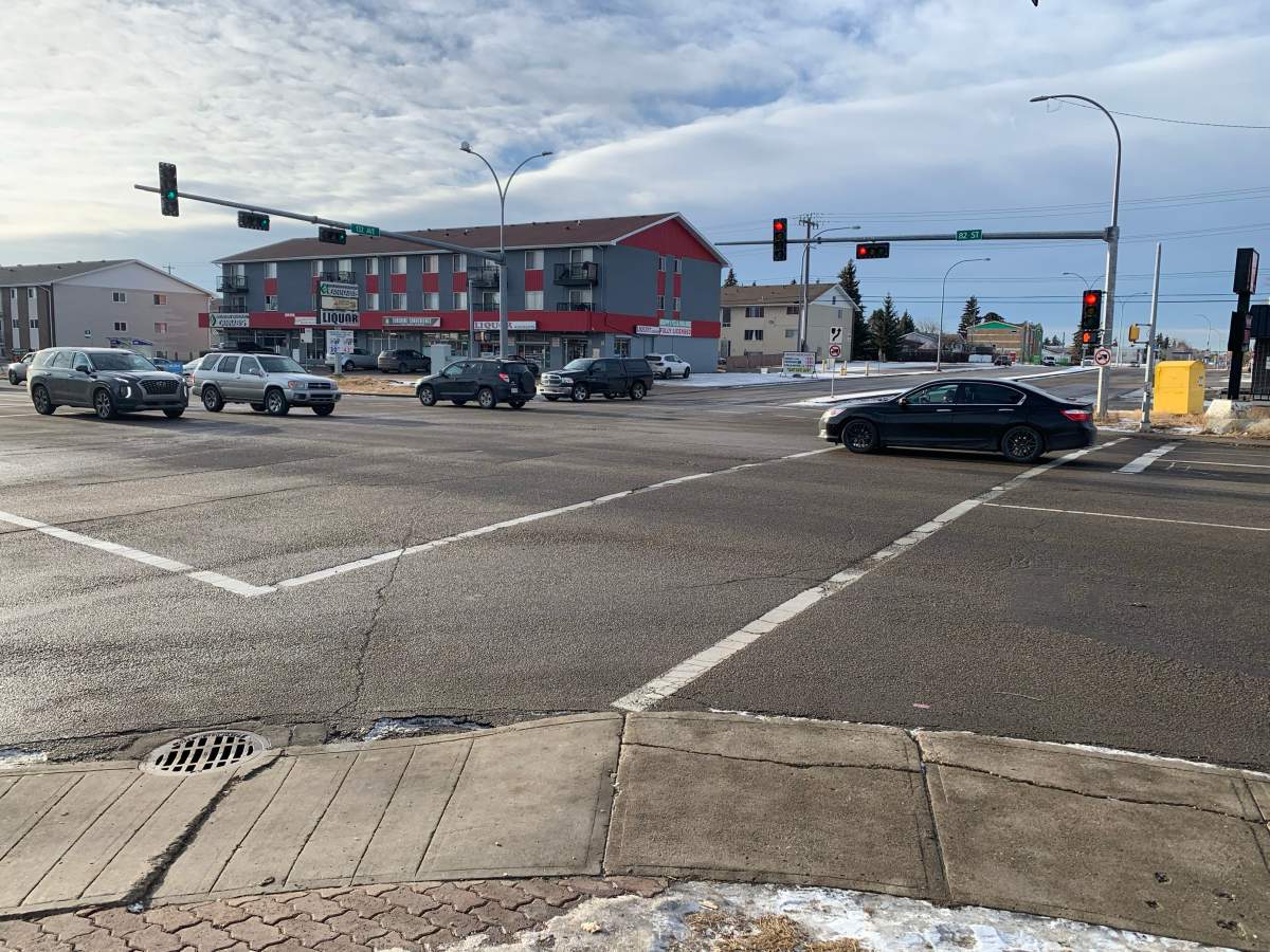 Edmonton police say a 41-year-old man suffered life-threatening injuries after he was struck and dragged by a truck in a north Edmonton intersection.