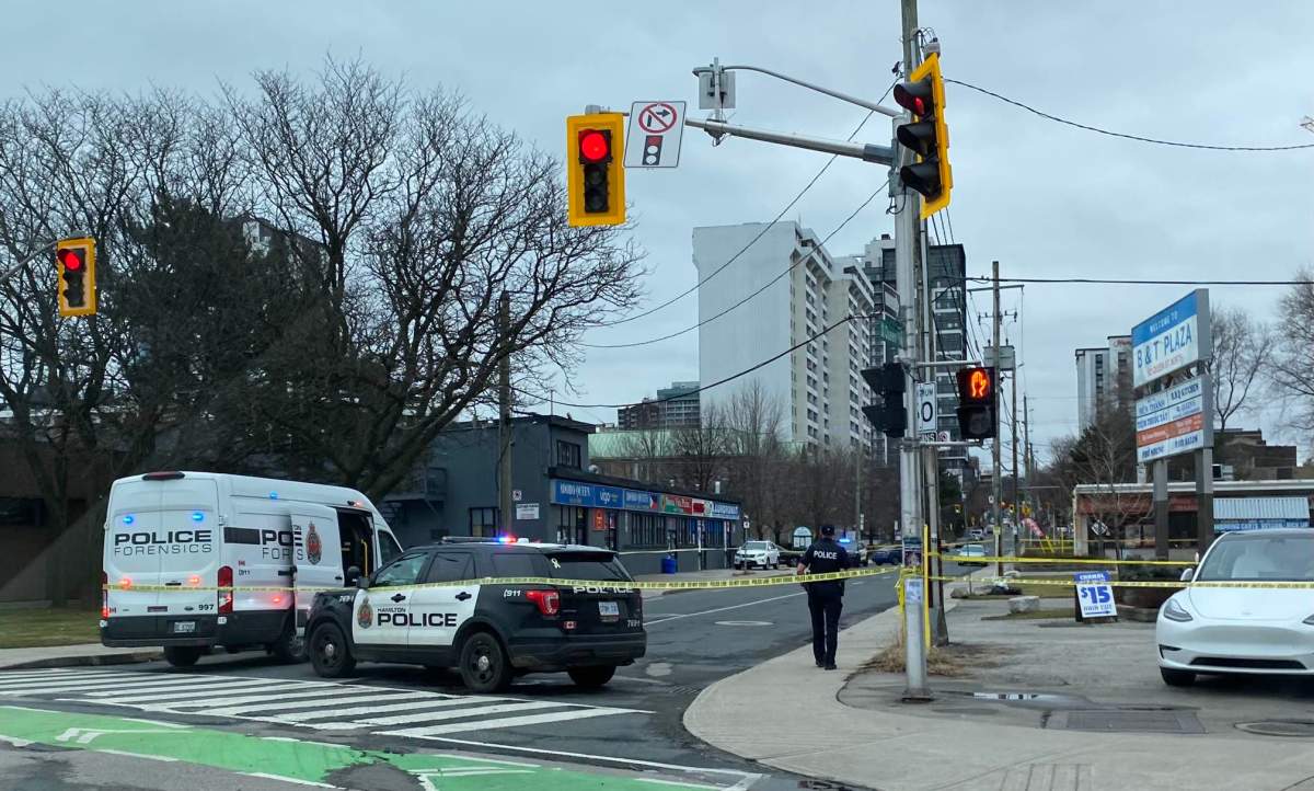Hamilton police on scene at York Boulevard and Queen Street North on Dec. 30, hours after a local man was shot dead.