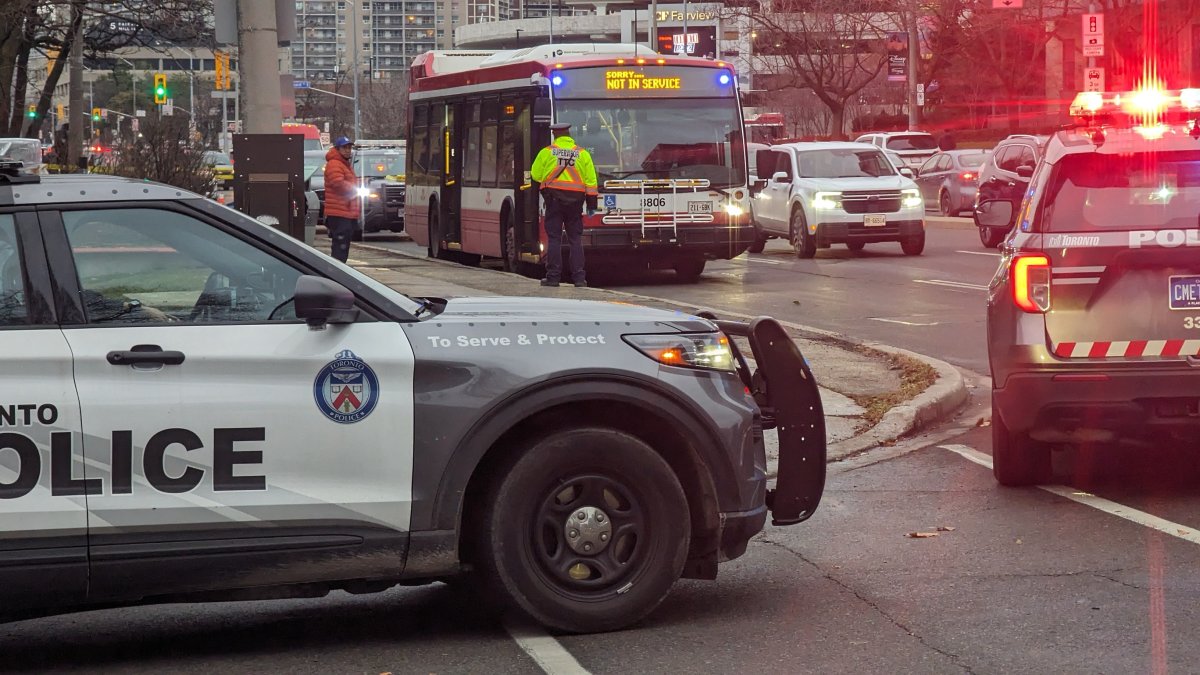 Police at the scene following a stabbing last Saturday. Toronto police said Thursday they had arrested two 14-year-old boys, with one facing a charge of attempted murder.
