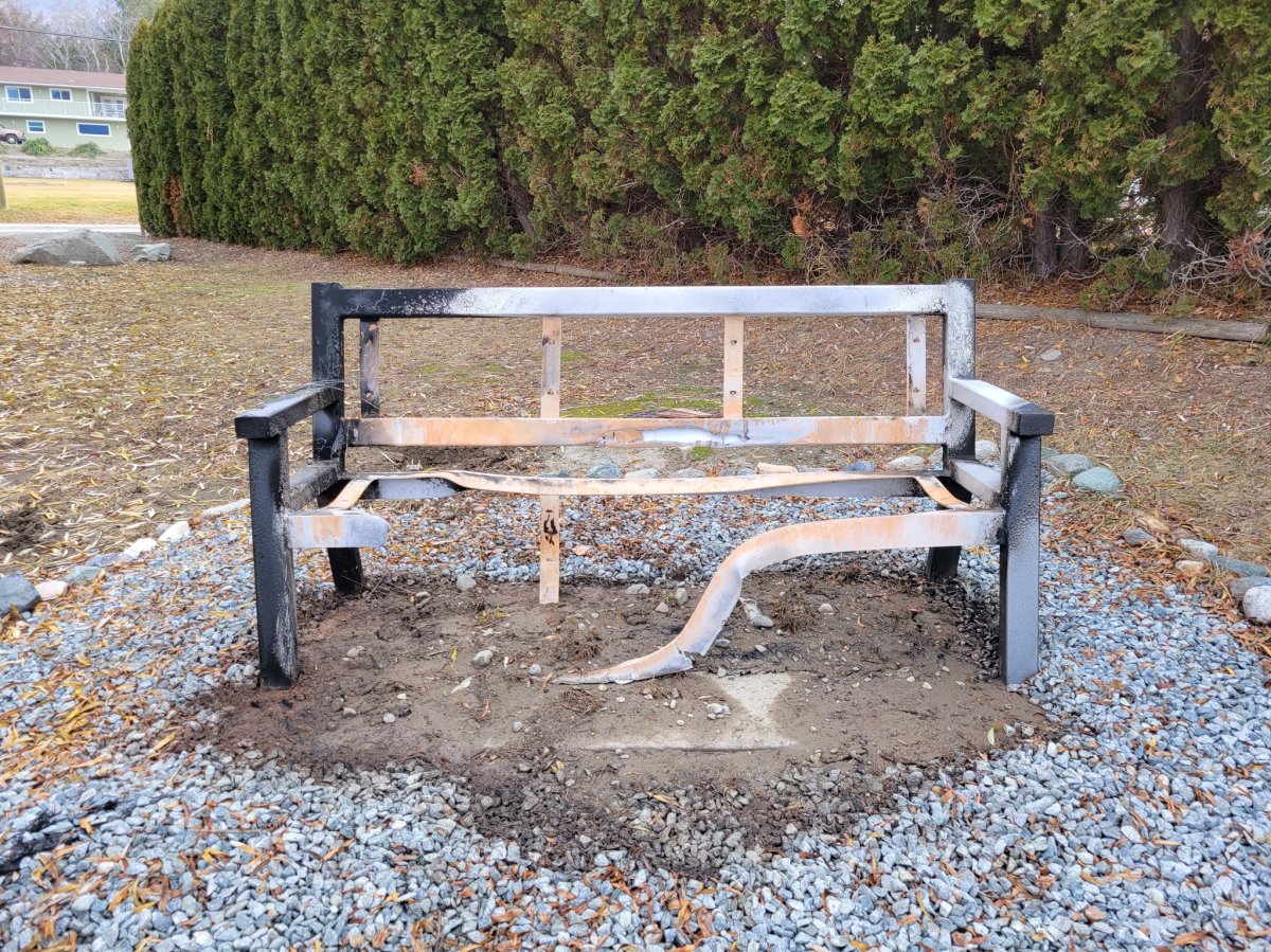 A photo of the fire-damaged memorial bench in Osoyoos, B.C.