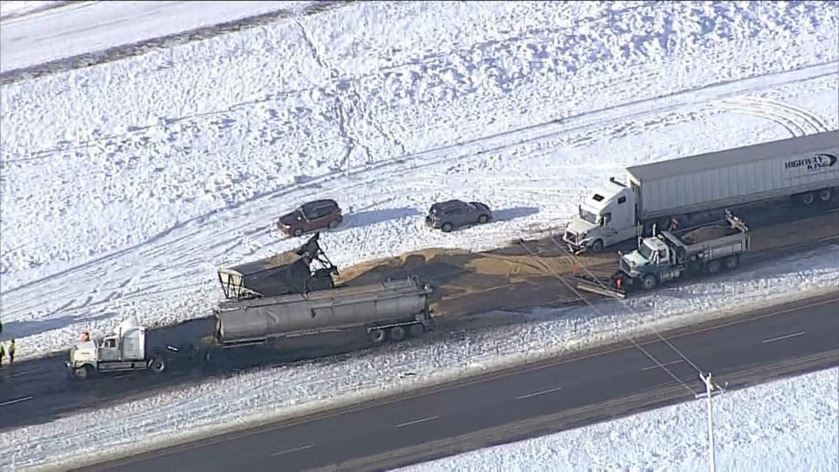 A load of grain spilled along the QEII highway on Dec. 15, 2023 after multiple crash occurred in the area of Highway 27, including one fatal crash.