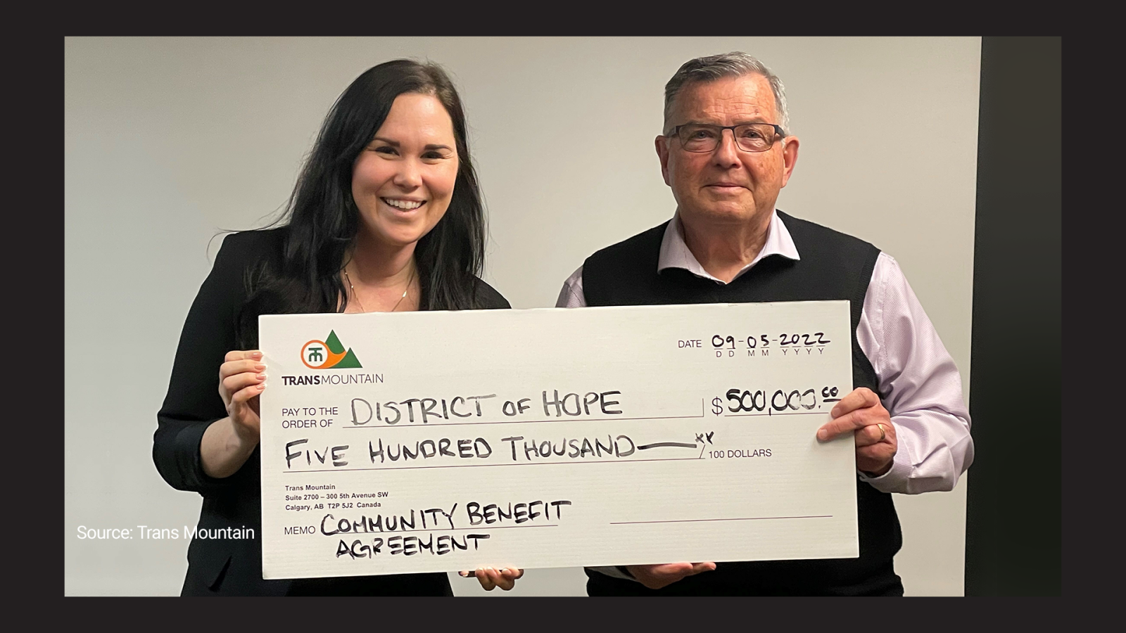 Former Mayor of the District of Hope, Peter Robb, is photographed next to community liaison Leah Caldow in 2022. Trans Mountain provided a $500,000 payment as part of a "community benefit agreement" for the construction of a multi-use pathway project.
