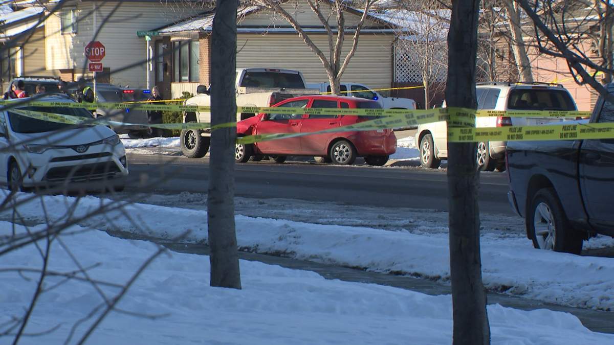Crime scene tape surrounds a Chevrolet Avro after the car fatally struck a man along Temple Drive Northeast and sent him into a tree on Dec. 12, 2023.